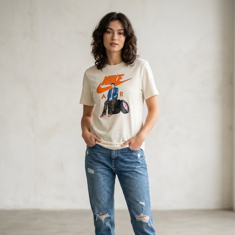 Nike Cream Graphic Tee with Orange Logo and Blue Jeans